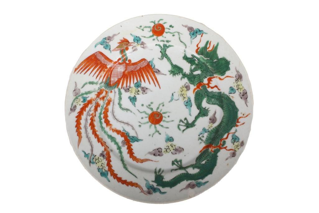 A Ming Jiajing Dynasty Dragon and Phoenix Enamel Plate: Chinese. A Ming Dynasty marked plate depicting a dragon and phoenix in hostility. Made of fine porcelain and colored enameling. Marked underside. Measures 7.25" in diameter. Glaze in good conditio