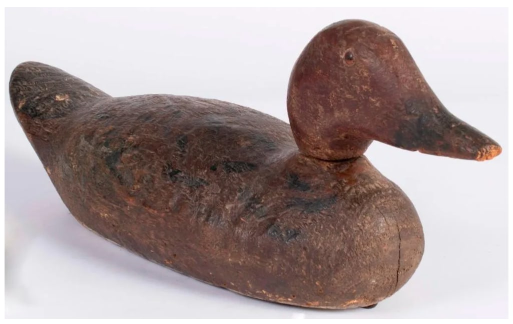 American, 19th century. A paint decorated duck decoy with marble eyes; ht. 7, wd. 5, dp. 17 inches. (1 of 5)