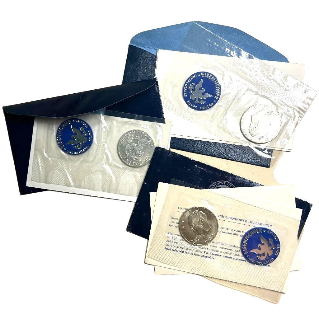 A lot of three 1971-1973 Eisenhower uncirculated Silver Dollars. (1 of 2)