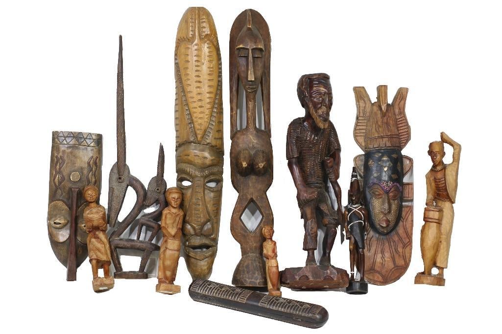 Africa, 20th century. A collection of twelve hand-carved African figurines and statuettes. Most (1 of 3)