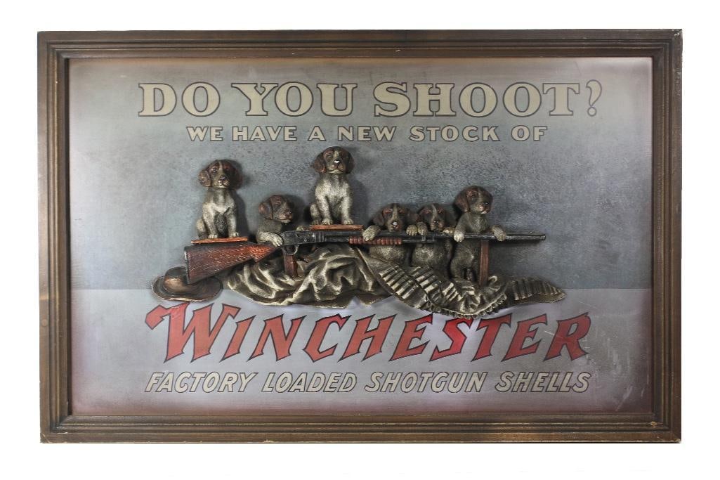 Modern Winchester sign, some loss to dog's noses. (1 of 2)