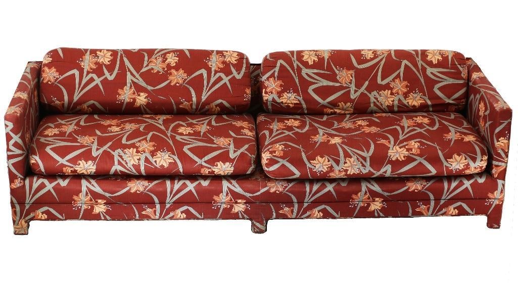 A 1970s Red Botanically Inspired and Lilly Flower Sofa: South America, 20th century. A wonderful floral couch likely from the 1970s. Appears to be custom made and does not have a makers mark; overall good condition. Measures 97.0" l x 33" w x 29&