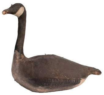 An Antique Painted Canvas Goose Decoy: American or Canadian, late 19th century. A painted canvas goose decoy; ht. 19, wd. 10, dp. 26 inches. Provenance: Property from the estate collection of John D. Schofield, Newnan, Georgia Overall good