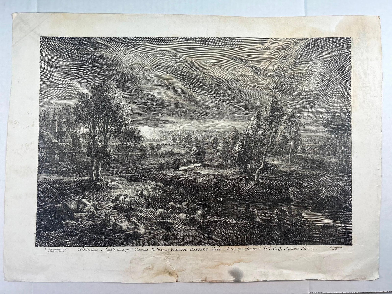 "A Landscape with a Village" after Peter Paul Rubbens: Continental, 19th century. A copperplate engraving after Peter Paul Rubbens, published by Gillis Hendricx (Flemish, active 1640-1677). Measures 15 x 20 inches on wove paper. Fair condition; some moldi