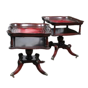 A Pair of Regency Style Mahogany Tiered Leather Top Accent Tables