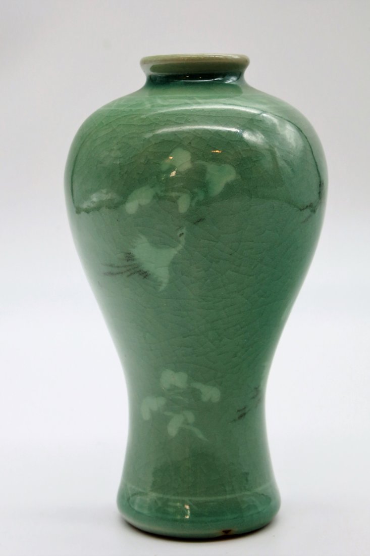 Celadon Vase: Signed at the base, Featuring beautiful hand-painted white Cranes or Herons with a craquelure finish. The flying Herons symbolize a female whereas when painted inside a circle it is male. The shape of