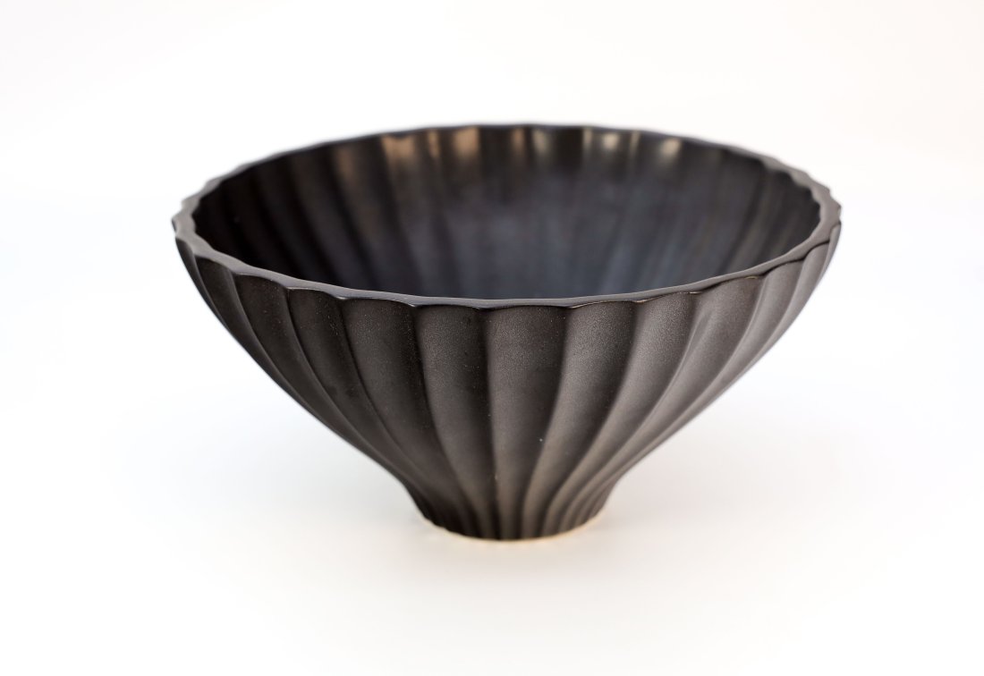 Jonathon Adler Lantern Bowl: Jonathan Adler Blackware, fluted details from the rim to the base, marked underside, Handmade in Peru. 10.25" D x 5" H x 3.25"D Base