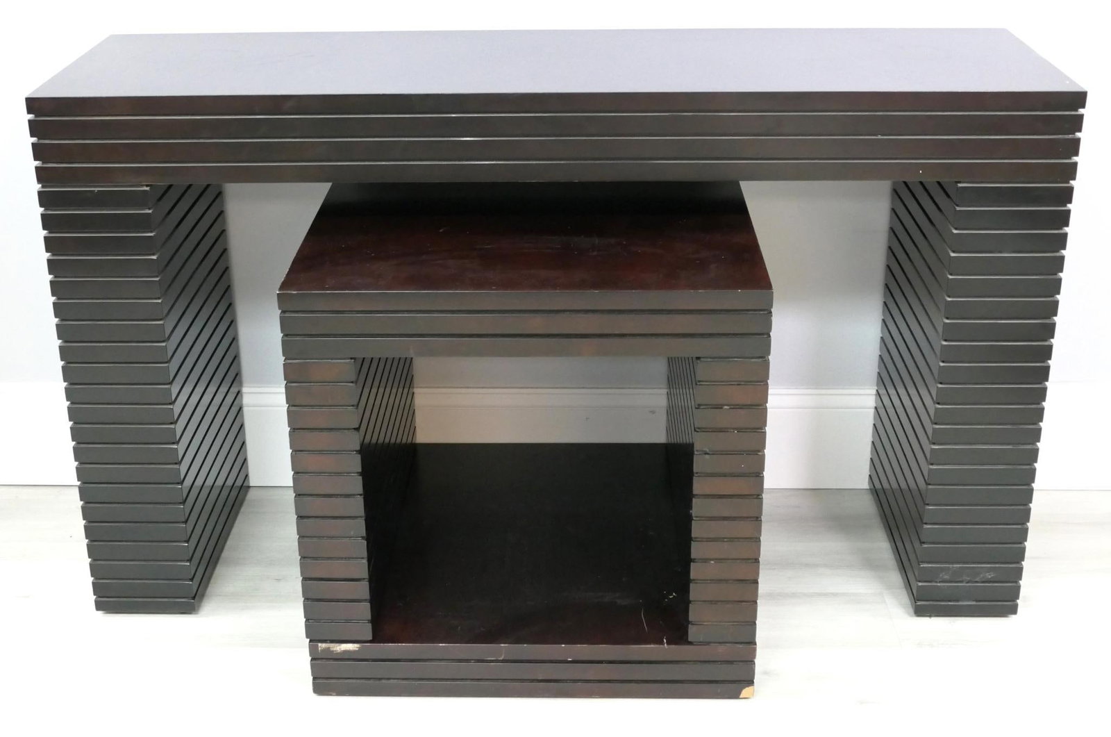 Modern Console and Side Table: Modern console and side tables in matching horizontal cut line motif and dark finish. Both pieces have surface damage and finish wear.Size: 24"w x 24"d x 23.5"h