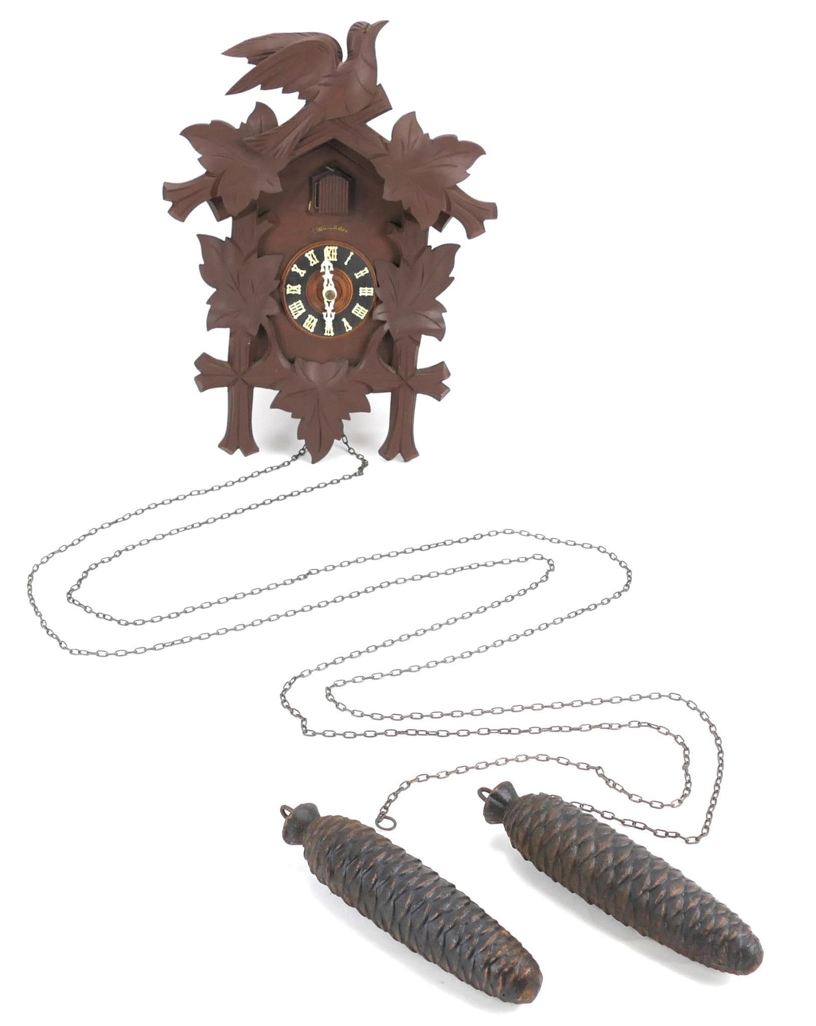 20th Century German Cuckoo Clock: 20th century German carved style cuckoo clock marked Heco 8 Day with paper label on back Imported and guaranteed by Henry Coehler Co Inc. Weights present, untested. 11"w x 6"d x 15"h