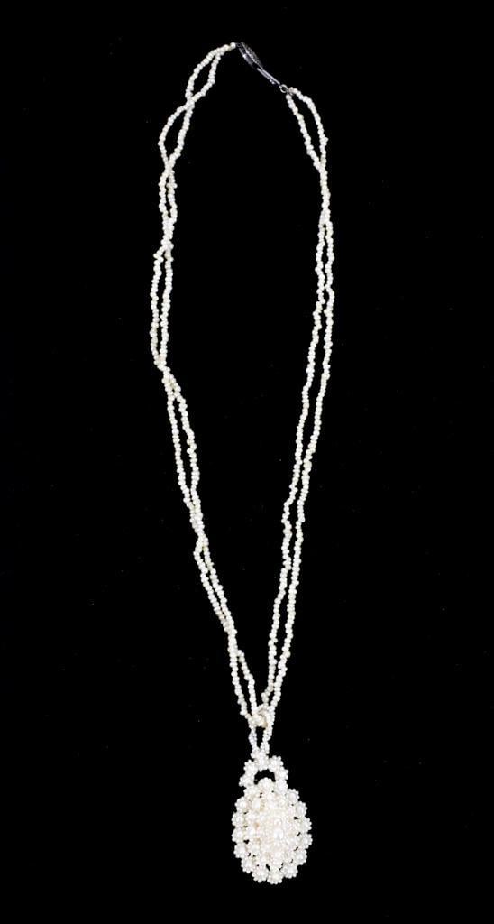 Georgian Antique Double Strand Seed Pearl Necklace: Georgian antique double strand seed pearl necklace with tear-shaped seed pearl pendant consisting of multiple rows of floral set seed pearls mounted to mother of pearl back. White metal clasp and unma