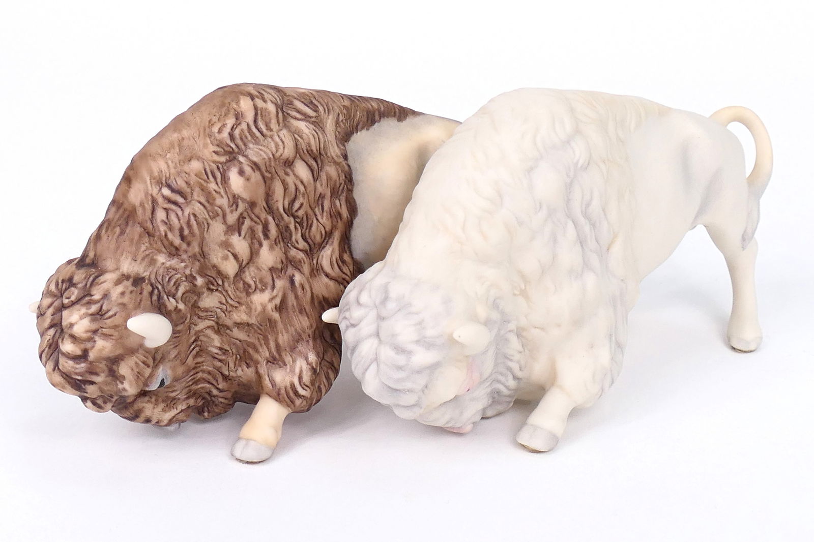 Cybis "Double-Buffalo" Figurine: Porcelain figurine by Cybis titled "Double-Buffalo", one of which is albino. Marked and dated 1968. Size: 7.5"L