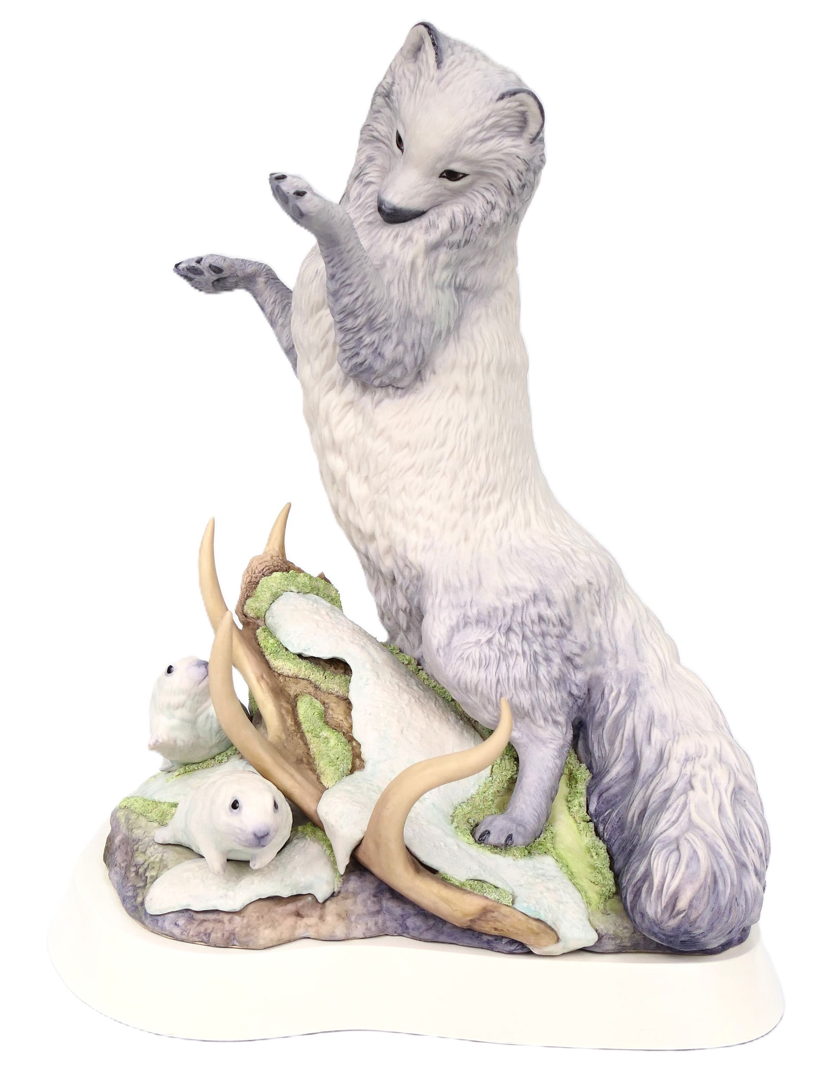 Cybis "Arctic Fox" Statue: Large porcelain statue by Cybis titled "Arctic Fox", depicting the carnivore pouncing upon a pair of arctic herbivores, accented by a detached antler. Marked on the base and numbered 32. Removable fro