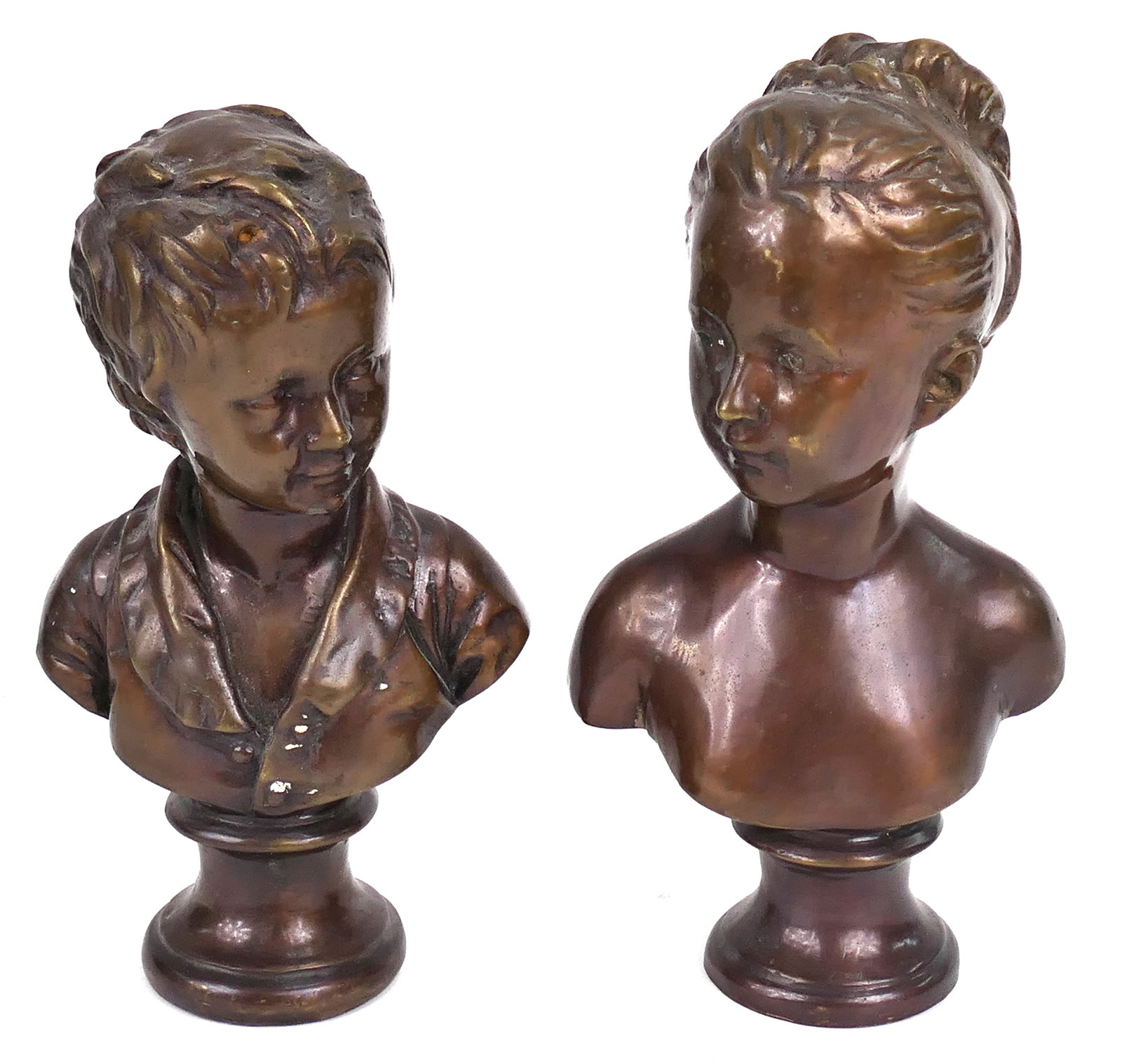 Pair of French Bronze Busts: Pair of French bronze busts depicting a boy and a girl, each on pedestal base. Size: Girl 9"h