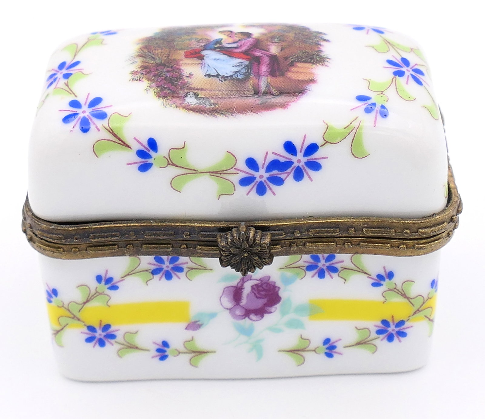 Floral Courtship Scene Trinket Box: Hand painted porcelain trinket box featuring a courtship scene on the lid surrounded by floral accenting. Marked on the bottom with a gold tone crown mark and OC CO. Size: 2.25"w x 1.25"d x 1.75"h