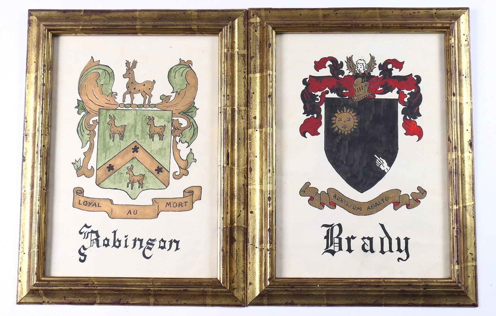 Family Crest Painting Pair: Pair of paintings depicting family crests for the names "Brady" and "Robinson" within coats of arms. Each is displayed in a gold tone wooden frame. One is creased. Size: Exposed Area of Art 9"w x 13"h