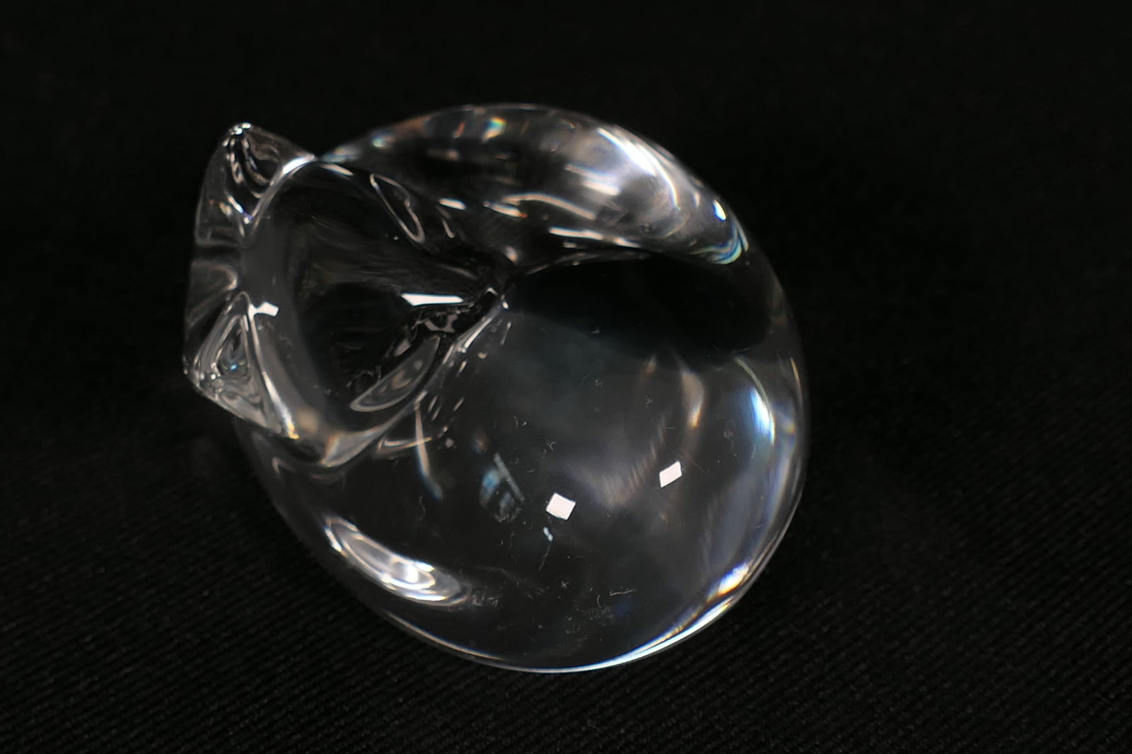 Steuben Sleeping Cat: Steuben crystal sleeping cat. Marked with etched signature. Box included. Size: 2.5"w x 1.5"h Location: Den