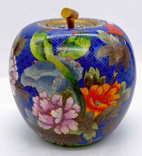 Chinese Cloisonne Apple Shaped Ginger Jar: Chinese cloisonne and brass ginger jar in the form of an apple with brass stemmed lid. Features birds, flowers, and butterflies on cobalt blue background. Size: 8"h Location: Sitting Room