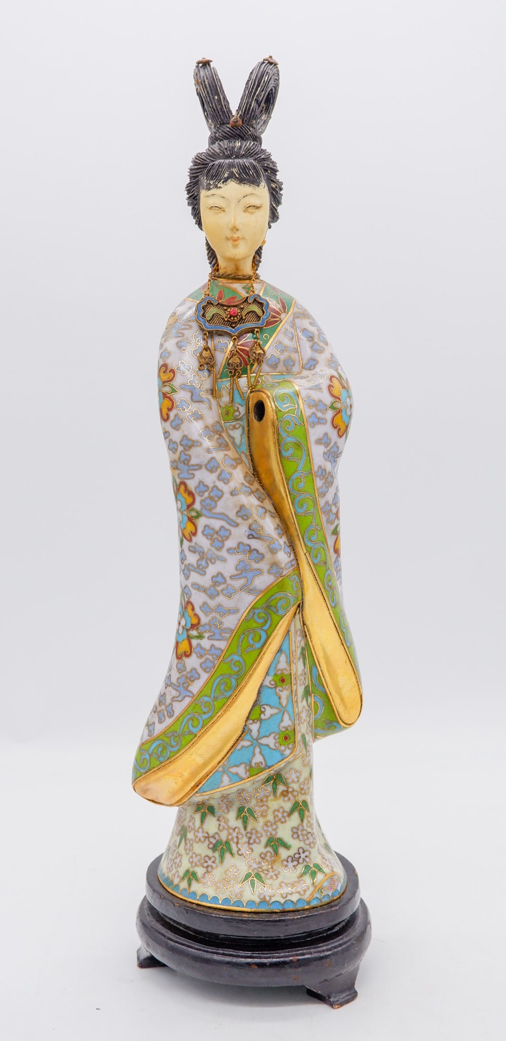 Chinese Cloisonne Enamel Geisha in Traditional Attire: Chinese cloisonne enamel geisha in traditional attire with a distinctive hairstyle on an attached wooden base. Missing her hand. Size: 13.75"h Location: Sitting Room