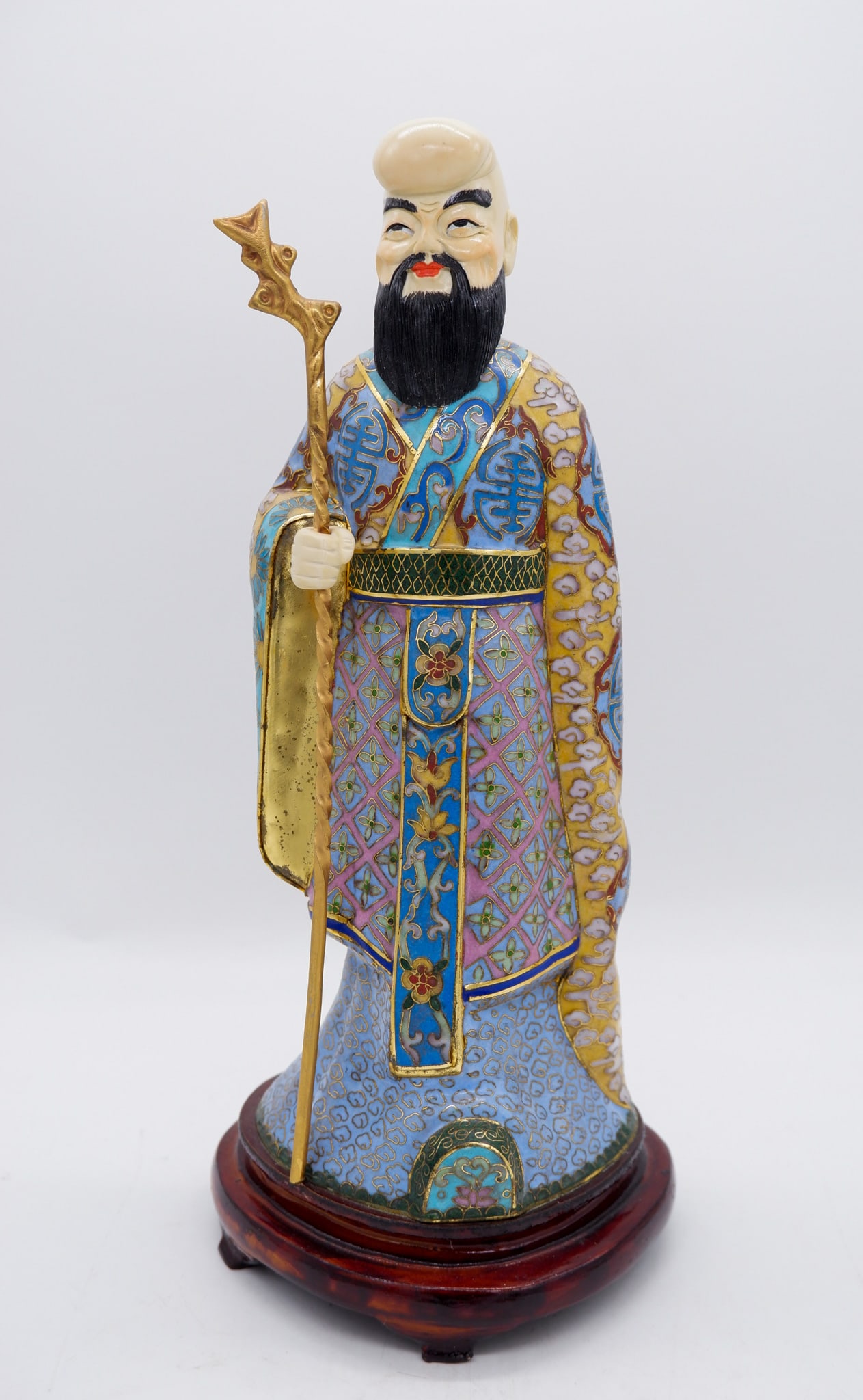 Cloisonne Figurine of Li Tieguai "Iron-Crutch Li": Cloisonne figurine of Li Tieguai, also known as "Iron-Crutch Li", one of the Eight Immortals in Taoist folklore, on attached wooden base. Size: 13"h Location: Sitting Room