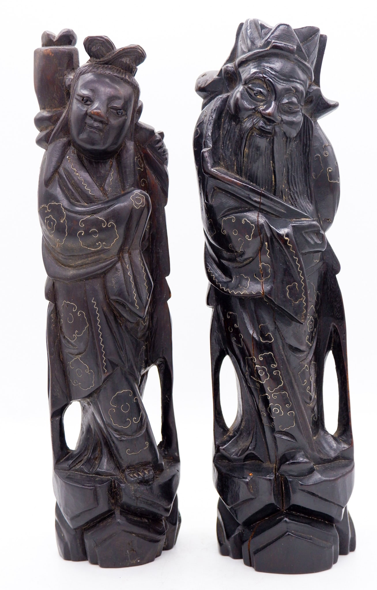 Wood Carved Asian Sculptures: Pair of wood carved with gold tone inlay Asian style sculptures depicting Chinese Immortal figures. Size: 10.5"h Location: Dining Area