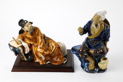 Two Glazed Mudmen Figurines