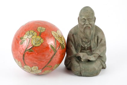 Decorative Ball and Asian Figurine