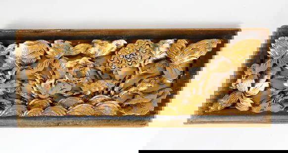 Hand Carved Wooden Wall Hanging Featuring Bird and Frog: Hand carved wooden wall hanging featuring lotus flowers, seed pod, birds and a frog painted in gold. Surrounding wooden frame is bordered in faded black paint showing cracks and wear. There is wood se