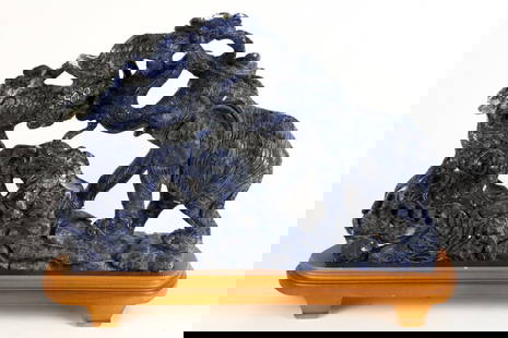 Hand Carved Lapis Sculpture Featuring Elephants: Hand carved lapis sculpture featuring elephants attached to oblong footed wooden base. Size: 10"h Location: Office
