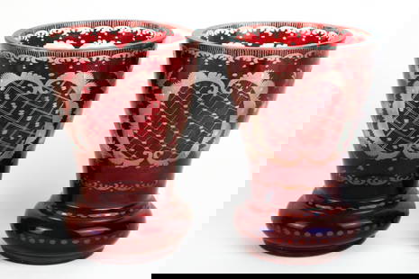 Pair of Antique Bohemian Ruby Cut-to-Clear Glass Tumblers: Pair of Antique Bohemian ruby flash cut-to-clear glass tumblers showcasing a vibrant ruby red overlay that has been expertly cut back to reveal intricate designs in clear crystal. These tumblers have