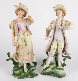 Pair of Hand Painted Bisque Figurines: Pair of hand painted bisque porcelain figurines in period attire. The woman has a crack, both have residue on the bottom. Size: 13"h Location: Primary Bedroom