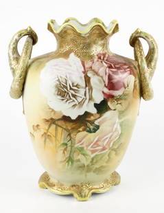 Nippon Floral and Gold Vase: Nippon double handled, hand painted floral and raised gold vase. Has a chip and crack on top. Size: 12"h Location: Primary Bathroom