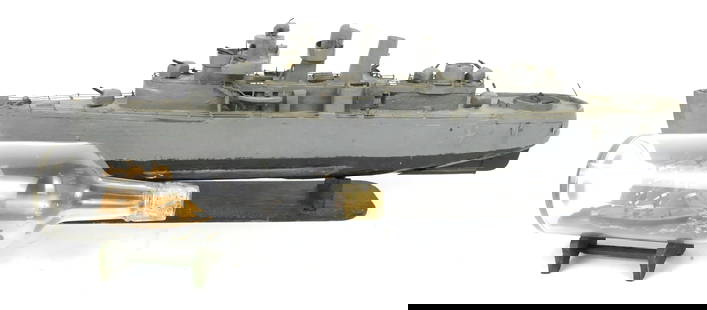 Two Model Ships: Two model ships including ship in a bottle and hand crafted and hand painted warship. Small chips, missing gun turrets. Size: Largest ship 24"w x 4"d x 8"h