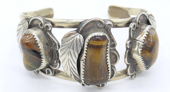 Vintage Native American Sterling Cuff with Tiger's Eye: Vintage Native American sterling cuff with tiger eye stones. Total weight: 1.210 ozt Size: 2.5"w x 2.25"h