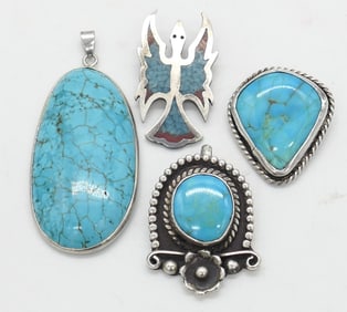 Four Sterling and Turquoise Pendants