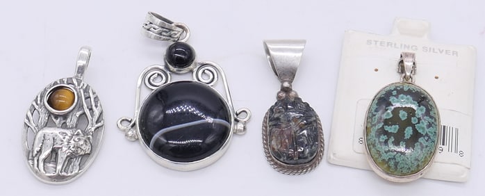 Four Sterling Pendants