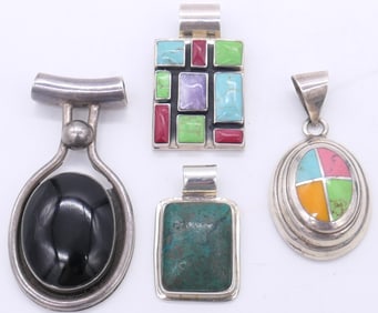 Four Sterling Pendants