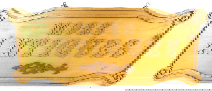 "More Antiques" Sign: "More Antiques" wooden sign with carved border and hanging chain. Trim is bowing on top. Size: 27.5"w x 11.25"h