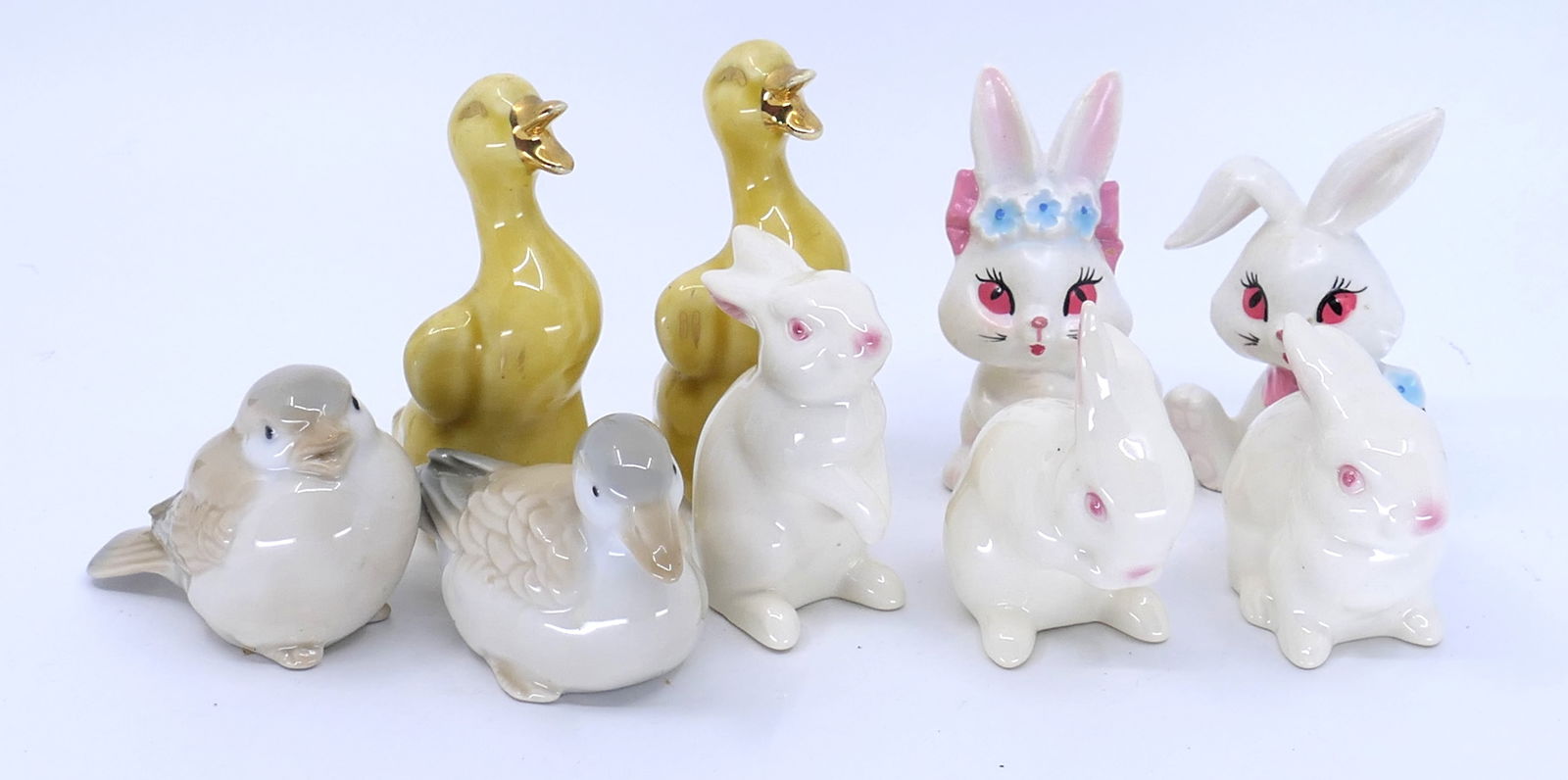Spring Ceramic Animals: Spring ceramic animals including (2) Lefton rabbits, (3) Goebel bunnies marked West Germany, (2) Homco birds and (2) unmarked ducks. Chips, ducks show cracks. Size: Duck 4.25"h Location: Dining Room