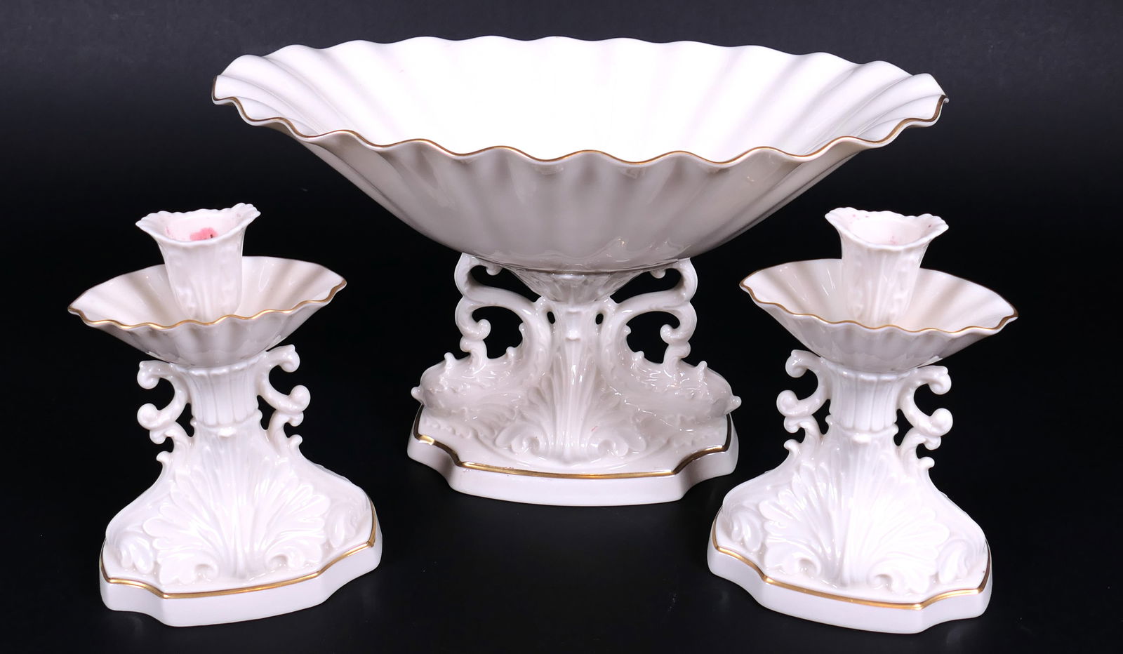 Lenox Aquarius Dolphin Centerpiece and Candlesticks: Lenox Aquarius dolphins centerpiece bowl and pair of coordinating candlesticks. Wax residue. Size: 12"w x 6.25"d x 7"h Location: Dining Room