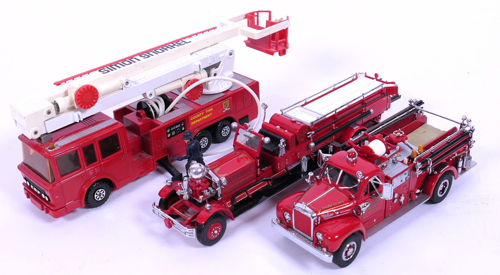 Three Large Matchbox Fire Engines: Three large Matchbox fire engines including Models of Yesteryear Ahrens Fox fire engines YSFE01 and Evans City pumper fire truck YYM35810. Plus Super Kings Snorkel fire engine K-39. Size: Largest 11"L