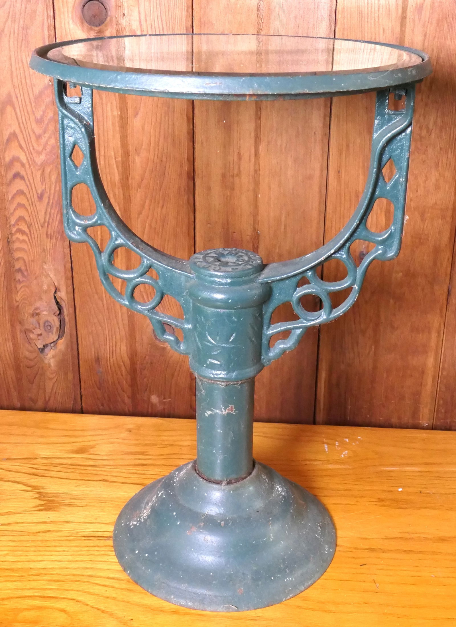 Antique Cast Metal Water Heater Stand: Antique cast metal water heater stand with beveled mirror top with vine accenting on column marked Big Ball Co Size: 12.5"dia x 19.5"h Location: Sunroom