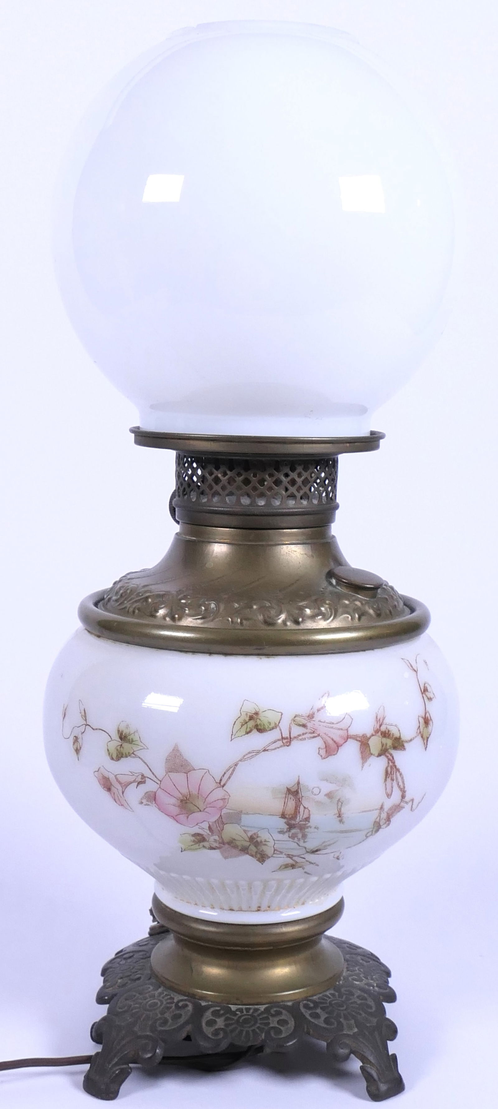 White Gone With the Wind Lamp: White Gone With the Wind lamp. Top globe is pure white with chipping at top and unoriginal . Bottom globe has pink transfer flowers. Lights. Size: 17.5"h Location: Kitchen