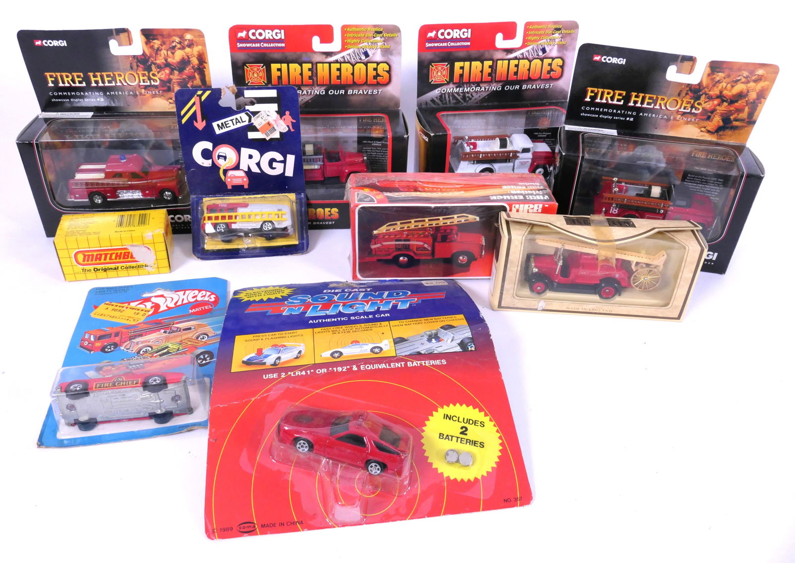 Ten New in Box Fire Trucks: Ten new in box fire trucks including Matchbox MB18 extending fire truck, (2) Corgi showcase collection, Open Pumper Boston FD and more, mostly from 1980's-2000's. Size: Largest box 6"w x 2.5"d x 3.5"h