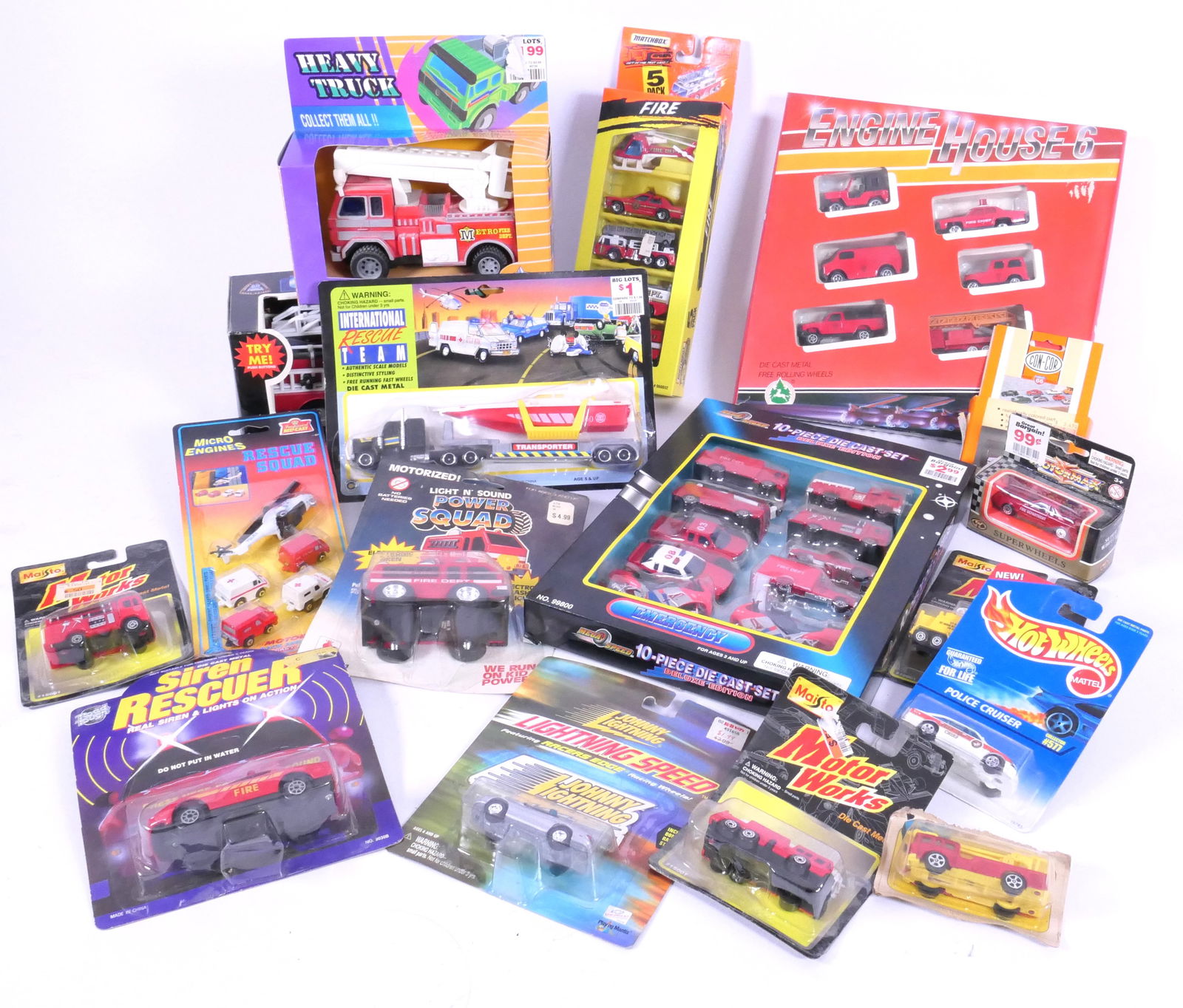 Unopened Fire Trucks and Rescue Vehicles: Unopened fire trucks and rescue vehicles including 1994 Matchbox fire 5 pack, Hot Wheels police cruiser, City Force Rescue Team and more. Size: Engine House Six box 11"w x 11"h Location: Basement