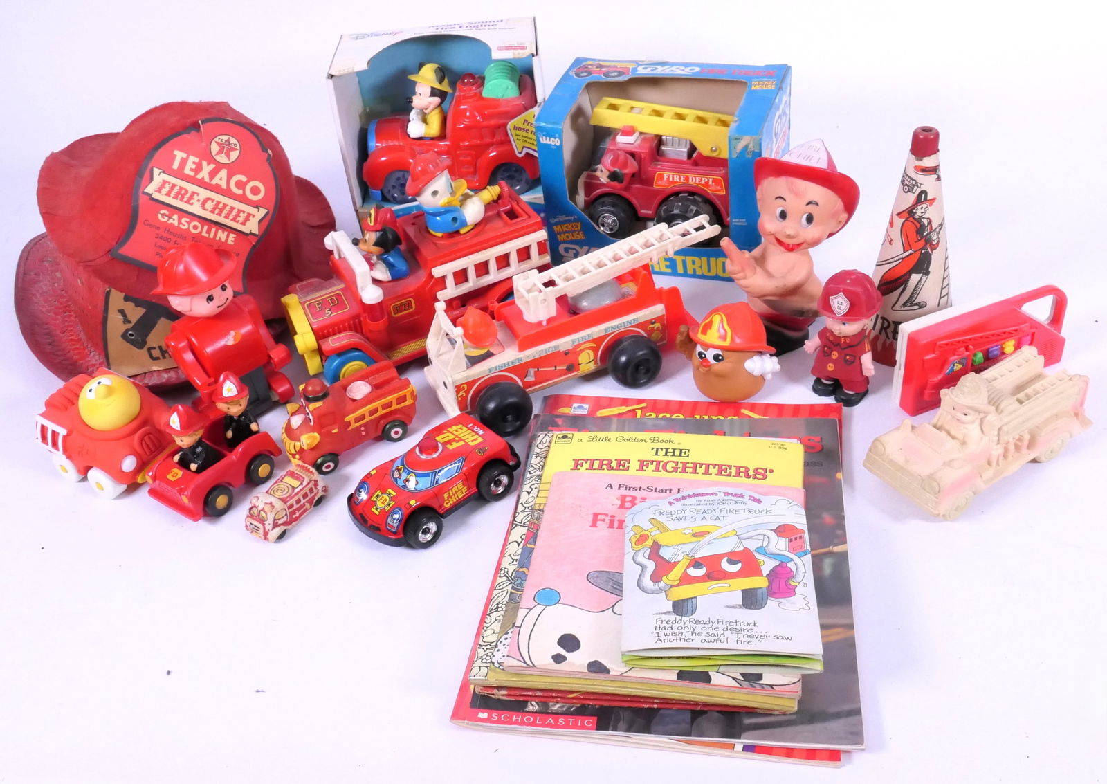 Children's Fire Fighter Theme Toys: Children's fire fighter theme toys includes 1950's-1960's helmets, (3) Mickey Mouse, 1960 Sun Rubber Co., 1956 Hirsch Toys baby figurine, 1968 Fischer Price pull toy and more. Some still in box, some