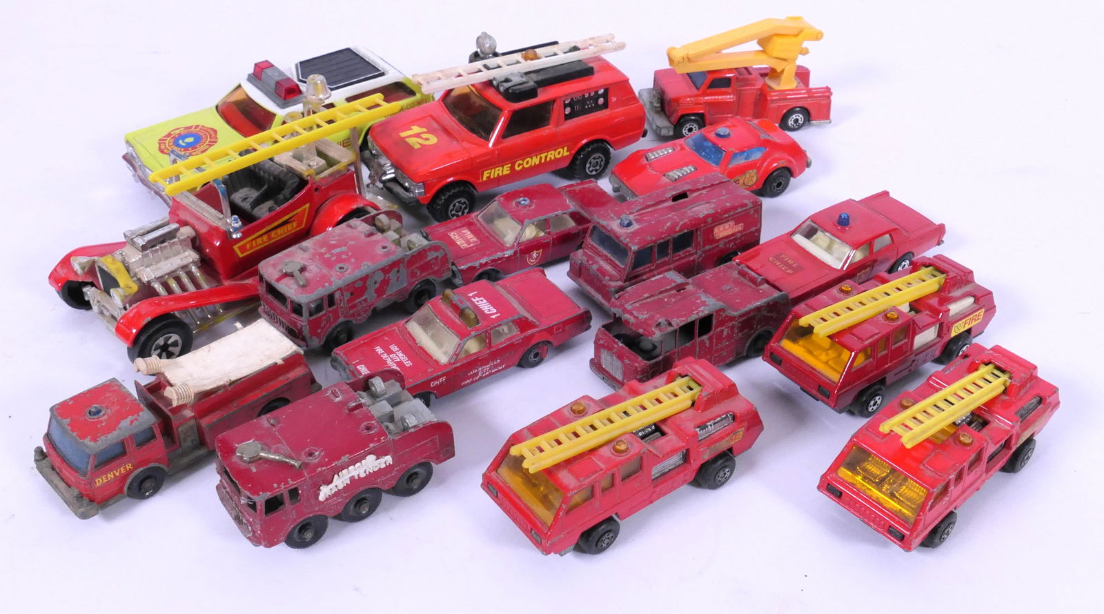 Matchbox and Lesney Cars: Matchbox and Lesney fire trucks and cars, most from 1970's. Played with condition. Size: Largest 4.5"L x 2"d x 2"h Location: Basement