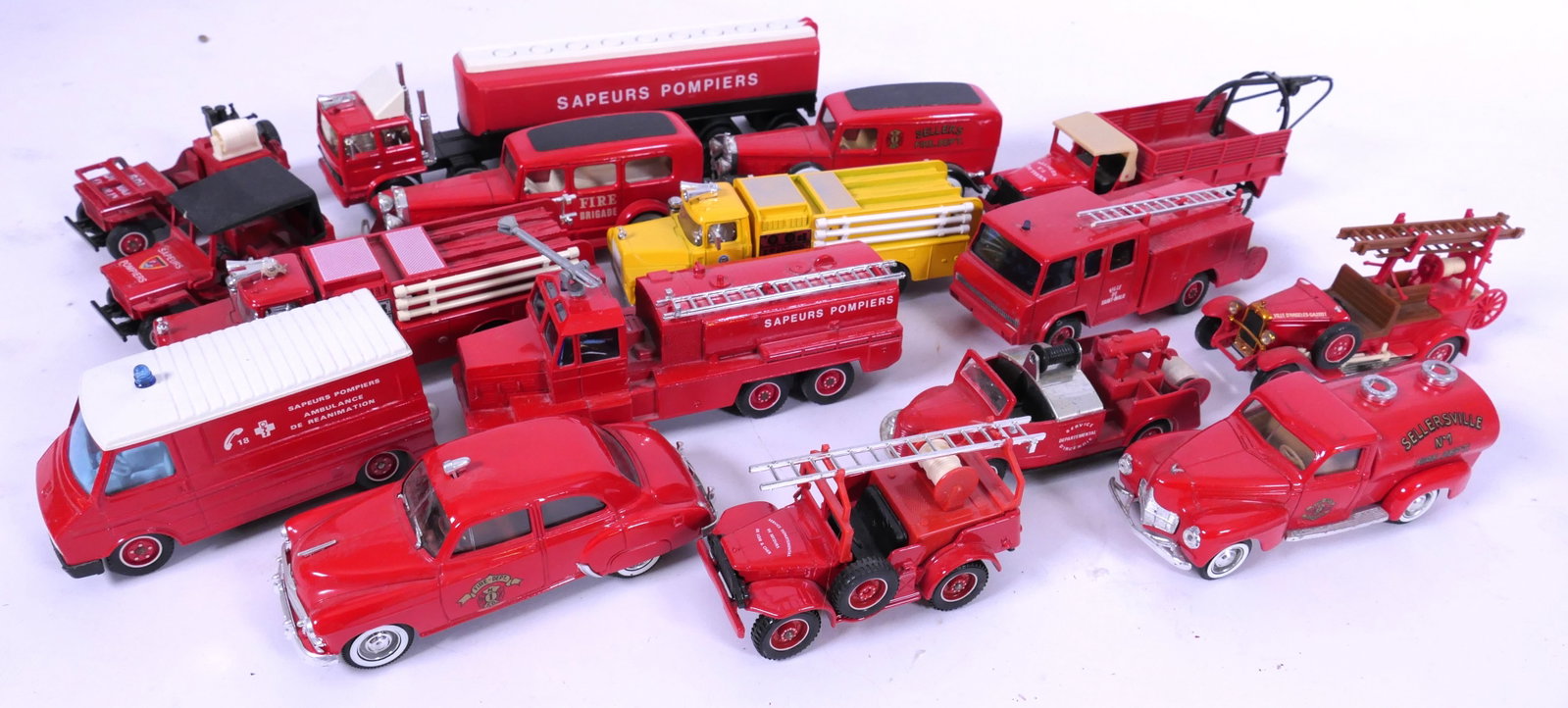 Solido France Diecast Fire Trucks: Solido France diecast fire trucks including Jeeps, 1931 Cadillac, fire brigade vans and more. Size: Largest 8.5"L x 1.5"d x 2"h Location: Basement