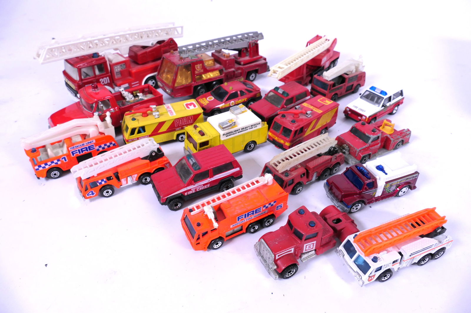 Matchbox Fire Trucks and Cars: Matchbox fire trucks and cars from 1970's - 2000's Ford F-100, Super Kings, K-9 Fire Tender and more. Played with condition. Size: Largest 7"L x 1.75"d x 2.75"h Location: Basement