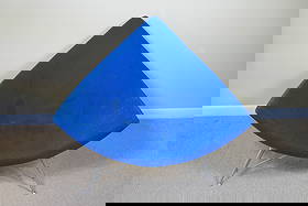 Original Period Coconut Chair by George Nelson: Sleek original period chair by designer George Nelson (American 1908-1986), in the Coconut chair design, circa late 1950's. This chair features a deep, rounded seat upholstered in blue, set on a solid