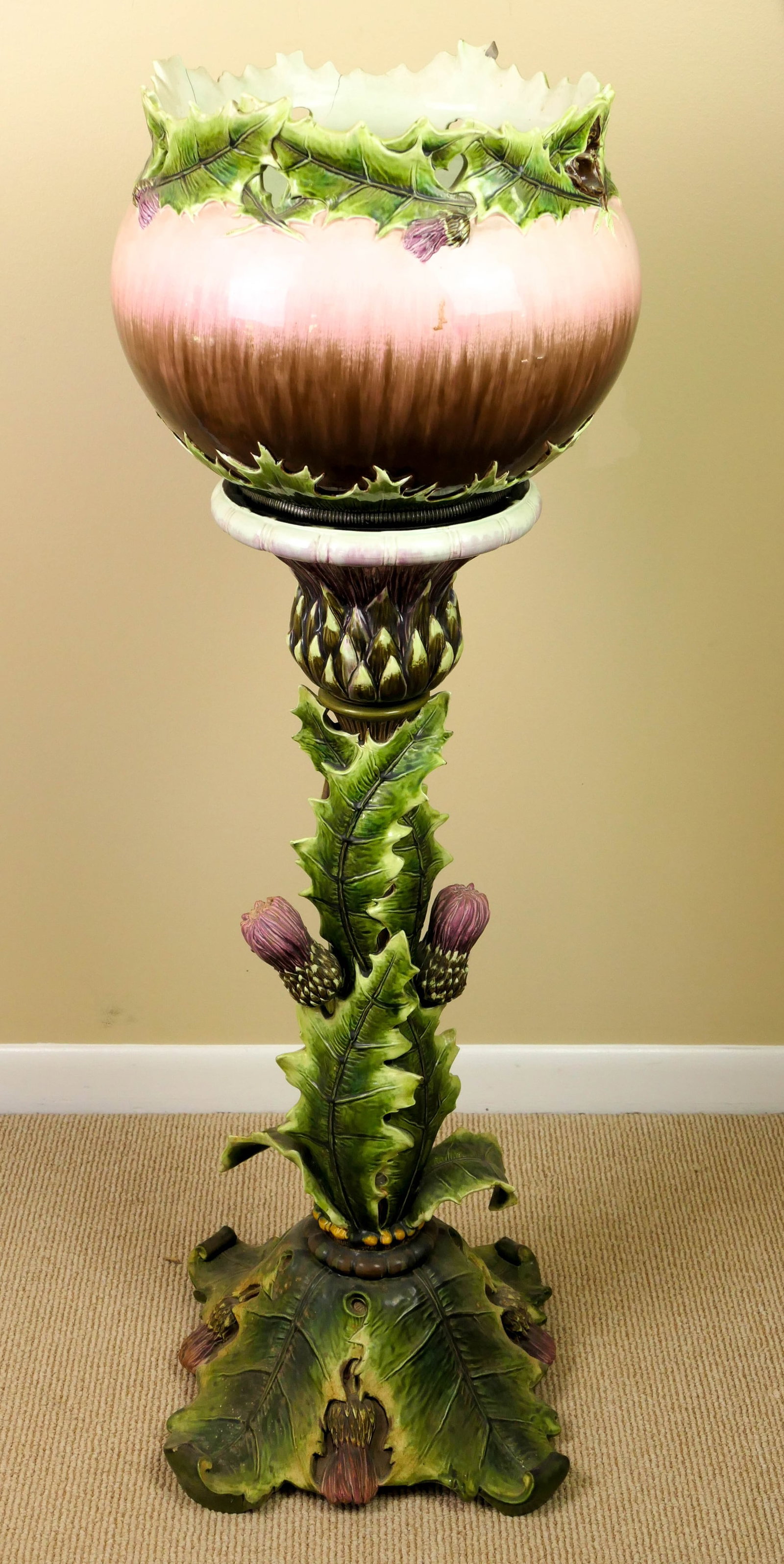 Majolica Dressler Jardiniere and Pedestal, Austria 1880's: Large Majolica thistle stand with removable bowl. Both stand and bowl marked "3932, Austria" and also has makers mark from Julius Dressler. Hairline cracks where bowl is pierced in rim. Size: Bowl 16"